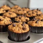 Juicy oat muffins arranged neatly, showcasing their fluffy tops and rich color.