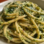 Delicious creamy pasta showcasing fresh spinach and garlic ingredients.