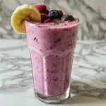 Juicy Banana Berry Smoothie featuring a mix of fresh berries and yogurt.