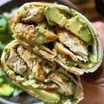 Tasty Chicken Avocado Wrap showcasing chicken and avocado slices.