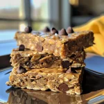 Detailed image of healthy oat bars with banana and chocolate chips, emphasizing their chewy consistency and toppings.