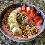 Juicy smoothie bowl featuring a blend of Greek yogurt and assorted toppings.