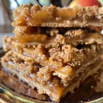 Close-up of golden brown Apple Crisp Bars with a crumbly topping.