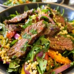 Juicy Moroccan beef stir-fry strips atop a bed of couscous and assorted vegetables.