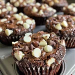 Close-up of a delicious triple-chocolate brownie cup topped with melted chocolate.