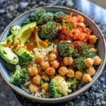 Close-up view of a vibrant veggie quinoa bowl with chickpeas and fresh vegetables.