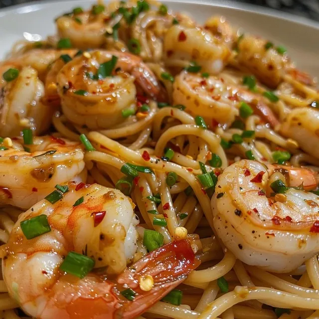 Speedy Shrimp Noodles Your New Favorite Flavor Fix Close-up of garlic shrimp noodles, showcasing juicy shrimp and vibrant veggies.