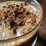 Close-up view of a glass of Mocha Cold Brew Coffee with a rich chocolate hue.