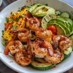A close-up view of a grilled shrimp and vegetable bowl, featuring juicy shrimp and colorful vegetables.