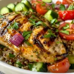 Juicy Mediterranean Grilled Chicken served with a colorful lemon herb quinoa salad.