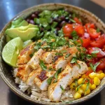 Close-up view of a Southwest Chicken Rice Bowl featuring colorful ingredients.