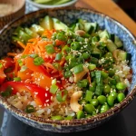 Close-up view of a colorful veggie rice bowl with vibrant bell peppers and zucchini.