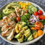 ['Close-up view of a vibrant Healthy Ranch Chicken Salad with colorful ingredients.', 'Side-angle photo of a Fresh Ranch Chicken Salad featuring chicken, greens, and vegetables.', 'Detailed close-up of a Healthy Chicken Salad showcasing greens, tomatoes, and a creamy dressing.', 'A mouthwatering display of Healthy Ranch Chicken Salad loaded with fresh veggies and herbs.']