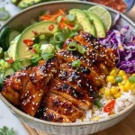 ['Close-up of a Hot Honey Chicken Bowl featuring juicy chicken, rice, avocado, and colorful veggies.', 'Side view of a Hot Honey Chicken Bowl with chicken thighs, garnished with green onions and sesame seeds.', 'Delicious Hot Honey Chicken Bowl showcasing a vibrant mix of ingredients including rice, avocado, and pickled onions.', 'Close-up image of a juicy Hot Honey Chicken Bowl with honey-glazed chicken, fresh cucumbers, and drizzled sriracha mayo.']