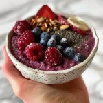 ['Close-up view of a layered Triple Berry Chia Pudding with fresh berries on top.', 'Side view of delicious chia pudding garnished with blueberries, raspberries, and blackberries.', 'Appetizing Triple Berry Chia Pudding in a glass, showcasing colorful berries and chia seeds.', 'A vibrant bowl of Triple Berry Chia Pudding, topped with fresh fruit and coconut flakes.']