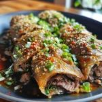 ['Close-up view of juicy Chinese green onion pancake beef rolls, showcasing layers and fillings.', 'Side view of delicious beef rolls wrapped in crispy green onion pancakes.', 'Detailed image of golden-brown pancakes filled with savory beef, garnished with green onions.', 'Close-up of a beef roll with visible textures and vibrant green onion pieces.']