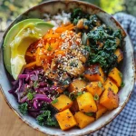 ['A close-up view of a colorful Vegan Buddha Bowl featuring rice, kale, avocado, and butternut squash.', 'A vibrant Vegan Buddha Bowl with layered ingredients including edamame beans, carrot ribbons, and purple cabbage.', 'A side view of a delicious Vegan Buddha Bowl showcasing a variety of fresh vegetables and grains.', 'An appetizing Vegan Buddha Bowl with a mix of nutritious ingredients, including tahini dressing and seeds.']