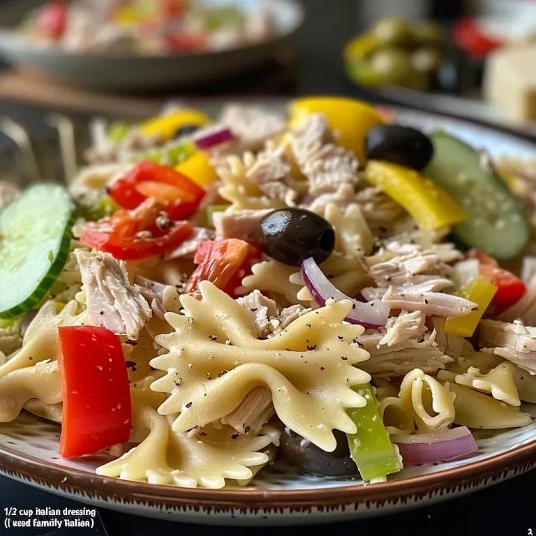 ['Close-up of a colorful Zesty Twisted Turkey Pasta Salad featuring vibrant ingredients.', 'Side view of a bowl filled with Zesty Twisted Turkey Pasta Salad, showcasing fresh vegetables and pasta.', 'Detailed image of Zesty Twisted Turkey Pasta Salad with julienned turkey and smoked provolone.', 'Close-up of a deliciously presented Zesty Twisted Turkey Pasta Salad with various colorful ingredients.']