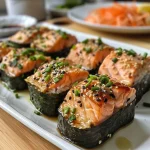 ['Close-up side view of delicious Killer Crack Salmon Muffins showcasing ingredients like salmon and nori.', 'Juicy salmon muffins with a crispy exterior, garnished with sesame seeds and scallions.', 'Mouthwatering salmon muffins presented with colorful toppings and a rich texture.', 'Freshly baked salmon muffins featuring a golden crust and visible chunks of salmon and vegetables.']