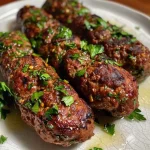 ['Juicy Mediterranean Beef Kofta skewers grilled to perfection.', 'Close-up view of seasoned beef kofta served with a creamy yogurt sauce.', 'Side profile of chargrilled Mediterranean Beef Kofta garnished with herbs.', 'Tasty beef kofta with fresh parsley and a side of cucumber yogurt dip.']