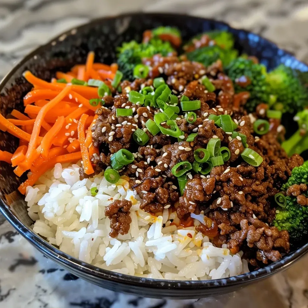 Close-up of a spicy Korean beef bowl with vibrant ingredients.
