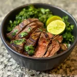 ['Close-up view of a healthy steak bowl filled with tender steak and fresh ingredients.', 'A vibrant healthy steak bowl showcasing marinated flank steak and colorful toppings.', 'Side view of a delicious steak bowl, highlighting juicy steak pieces garnished with fresh herbs.', 'Detailed image of a healthy steak bowl featuring steak, lime, and fresh vegetables.']