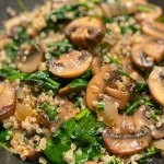 ['Close-up of a colorful quinoa skillet with spinach and mushrooms.', 'Freshly cooked quinoa with sautéed spinach and mushrooms in a skillet.', 'Vibrant dish of quinoa mixed with vegetables, showing greens and mushrooms.', 'Side view of a hearty quinoa dish featuring spinach and mushrooms.']