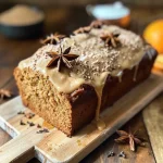 Close-up view of a slice of Chai Bread with a soft texture and spices.