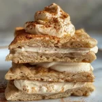 Close-up view of Gingerbread Spice Naan Dippers with cream cheese frosting.