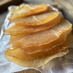 Close-up view of pear fruit leathers showcasing a rich, textured surface.