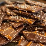 Close-up of salted caramel pretzel bark with chocolate and pretzel pieces.