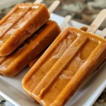 Close-up of a Sweet Potato Pie Plant-Based Popsicle with a creamy texture.